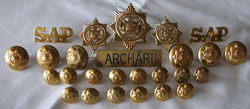 OLD SAP VOIDED CAP & COLLARS AS WORN BY EUROPEANS. 2X TITLES, NAME TAG & 20 BUTTONS.  ALL PINS INTAC