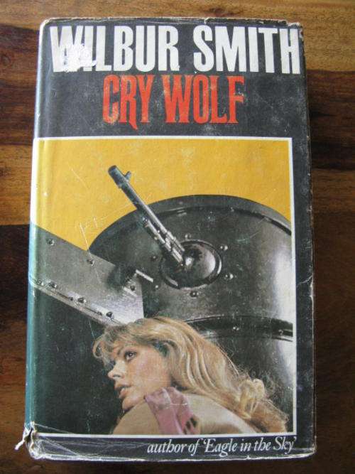WILBUR SMITH CRY WOLF 1ST EDITION PUBLISHED 1976 HARDCOVER WITH DUSTCOVER