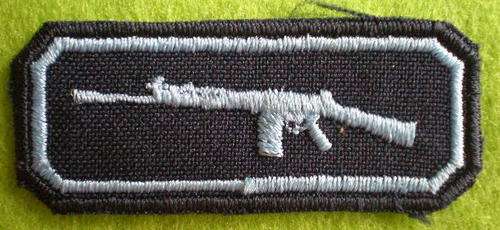 SAAF MUSKETRY QUALIFICATION BADGE -LIGHT BLUE EMBROIDERED ON DARK BLUE BACKING