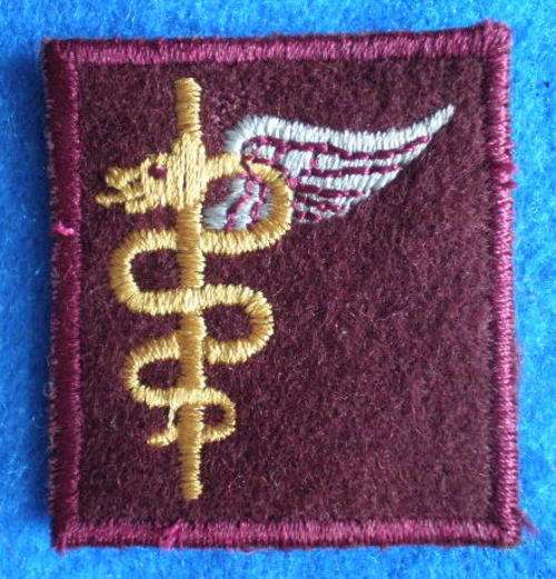 OPS MEDIC BREAST QUALIFICATION BADGE EMBROIDERED ON MAROON FELT.ORIGINAL