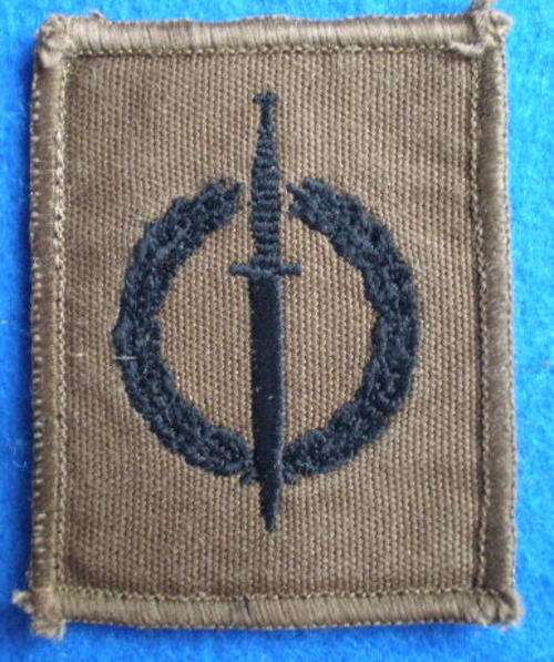 RECCE OPERATOR QUALIFICATION BADGE-BLACK THREAD EMBROIDERED ON NUTRIA WITH BROWN MERROW BORDER-ORIGI