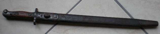 1907 PATTERN BAYONET-MANUFACTURER SANDERSON WITH SAP STAMPED MARKINGS ON WOODEN GRIP-TOTAL LENGTH 2