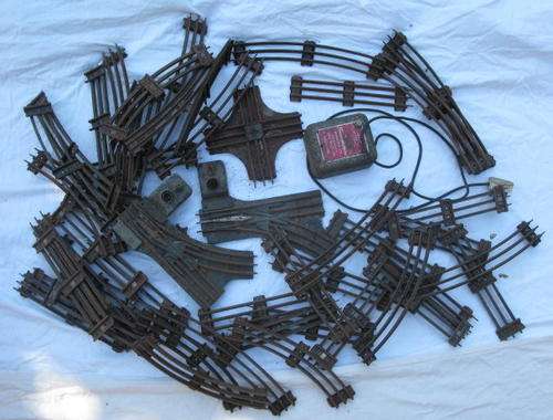SELECTION OF O GUAGE TRACKS SOLD TOGETHER WITH 12 VOLT(NOT SURE IF IT IS IN WORKING CONDITION): FOLL