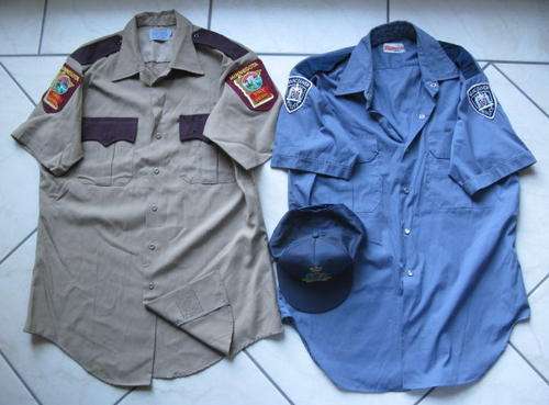 2X SHIRTS,THE ONE FOR THE MINNESOTA STATE PATROL,SIZE MEDIUIM MEASURES 53CM ARMPIT TO ARMPIT,THE OTH