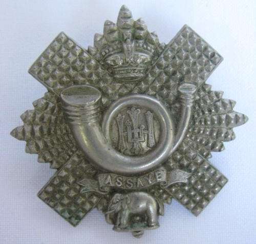 THE HIGHLAND LIGHT INFANTRY WHITE METAL CAP BADGE-WORN PRE 1902(QUEENS CROWN)-MEASURES 53X53MM-2 LUG