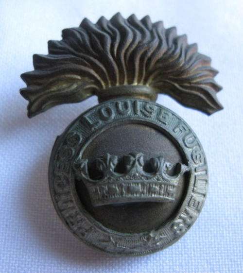 THE PRINCESS LOUISE FUSILIERS BADGE-2 LUGS-MEASURES 42X34MM