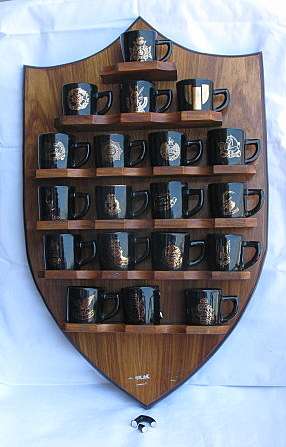 RHODESIAN COFFEE MUG COLLECTION OF 19 MUGS + STAND MADE BY NORBEL POTTERIES ST THE TIME