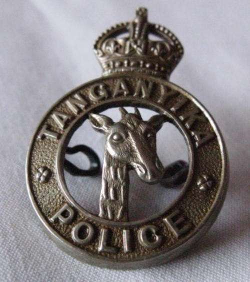 TANGANYIKA POLICE WHITE METAL CAP BADGE - 2 LUGS