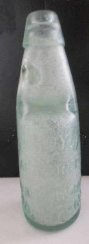 VINTAGE CODD BOTTLE - EMBOSSED ON THE FRONT ARE THE WORDS H.E. ROYAL MINERALS WATER WORKS ADDINGTON
