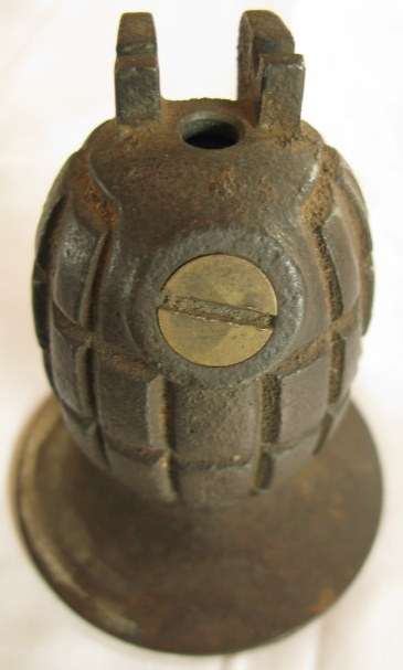 NO. 2656)  BRITISH MILLS WW1 GRENADE ON STAND.  TOTALLY INERT.