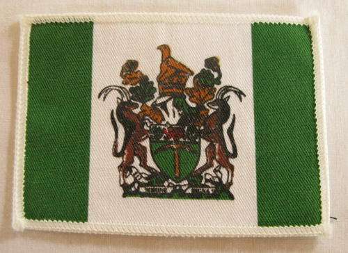 NO. 5093)  RHODESIAN CLOTH BADGE MEASURES 9 X 6,5CM.  SIDES OF THIS BADGE WHITE EMBROIDERED