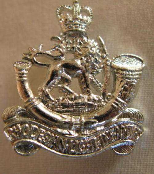 NO. 5479)  RHODESIAN LIGHT INFANTRY BERET BADGE.  OTHER RANKS WORN 1961-1972 - 2 STUDS.