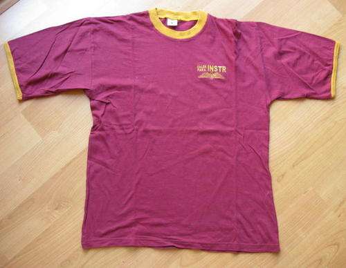NO. 5672)  PARACHUTE INSRTUCTOR T-SHIRT MAROON IS CURRENTLY WORN DURING GROUND TRAINING PHASE