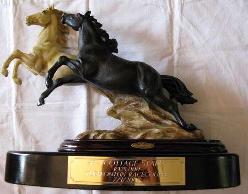 LA ANINA COLLECTION - HORSE STATUE CAST IN QUALITY DESIGNER RESIN MOUNTED ON WOOD.