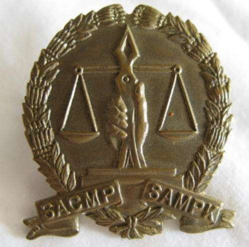 SA CORPS OF MILITARY POLICE GILDING METAL CAP BADGE WORN 1940-1958.  LUGS INTACT
