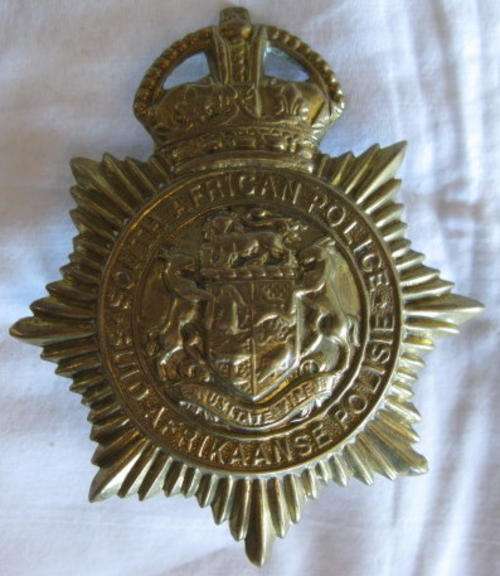 SA POLICE BRASS HELMET BADGE S TYPE WORN 1931 - 1957.  2 LUGS.  MEASURES 75X65MM