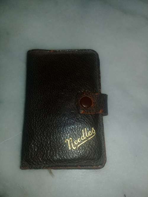 old neddle sowing kit in leather pouch