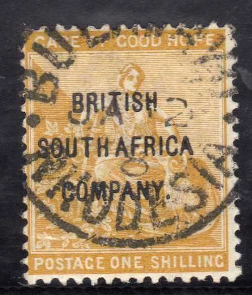 RHODESIA BSA COMPANY 1896 COGH OVERPRINTED 1/- YELLOW-OCHRE VFU. SACC 57. CAT R2000. (SACC 2017/18)
