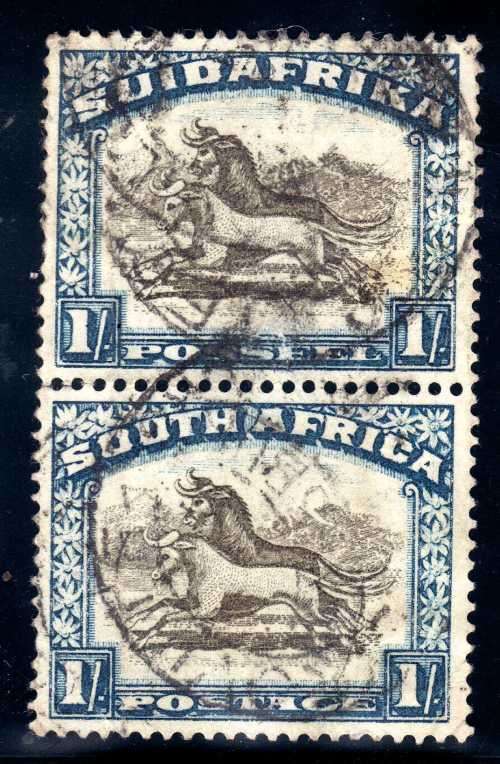 SOUTH AFRICA 1930-45 1/- BROWN & BLUE UPR WMK VERT PAIR USED. SACC 49. CAT R500 FOR HORIZONTAL PAIR.