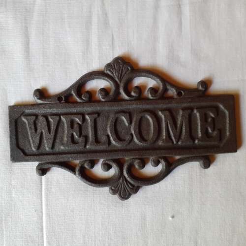 Cast Iron `WECOME` sign.