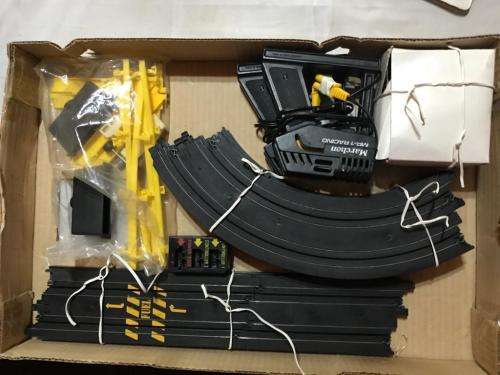 Slot car set with 4 cars. Not tested