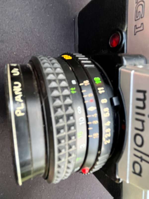 MAKINON zoom lense and MINOLTA film camera.