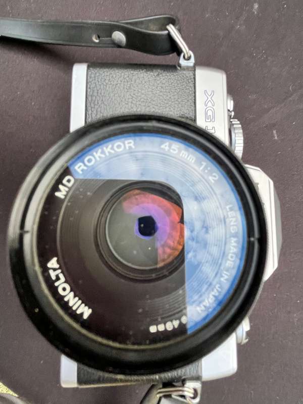 MAKINON zoom lense and MINOLTA film camera.