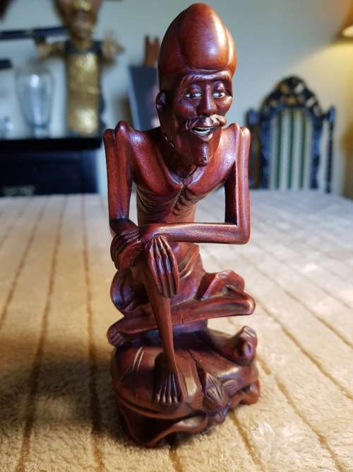 Antique wood carved netsuke figurine