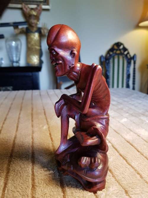 Antique wood carved netsuke figurine