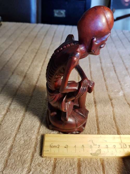 Antique wood carved netsuke figurine