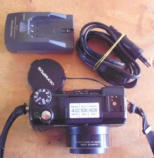 Camera Olympus with charger and battery for spares.