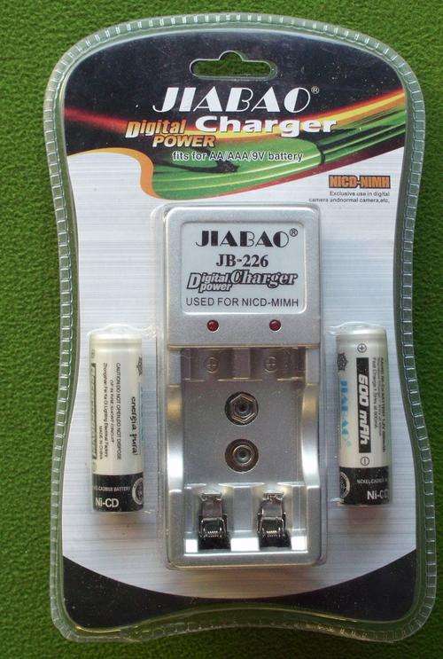 Battery charger + 2x AA batteries.