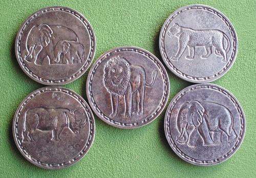 Metal coasters with wildlife emblems.