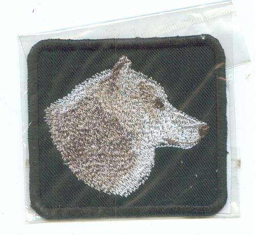 Embroidered SEW on badge Black. wolf