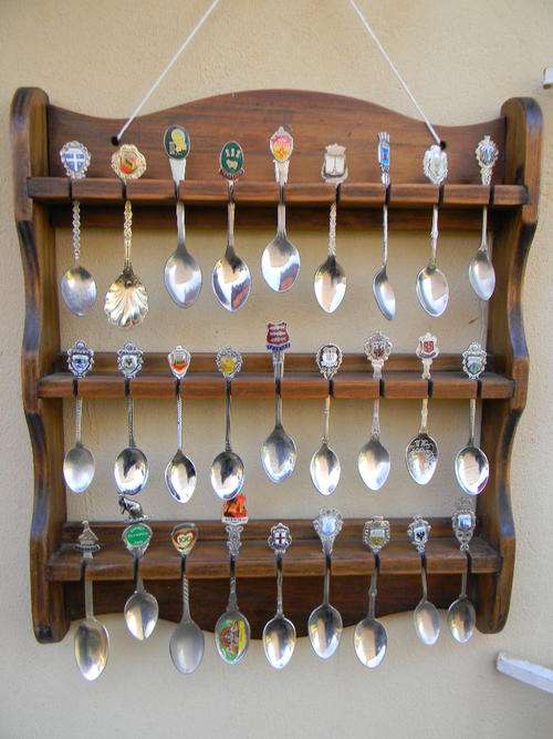 "WOW" 27 Stunning collector spoon fromaround the world with free rack. In good condition.