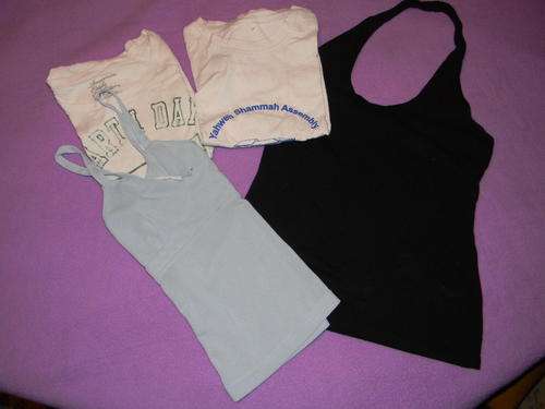 A bulk of women clothing.4 Pieces. See pictures. Size 32. In good condition.Postage R35.00