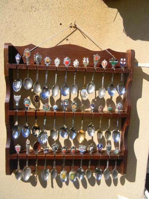 Over seas spoons with Towns and places with free rack, In good condition.