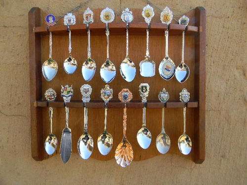 What a Lovely set of souvenir spoons of SA Towns and places. In excellent condition. With rack.