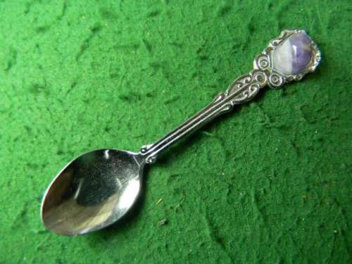 Crome plated spoon with gem stone in good condition