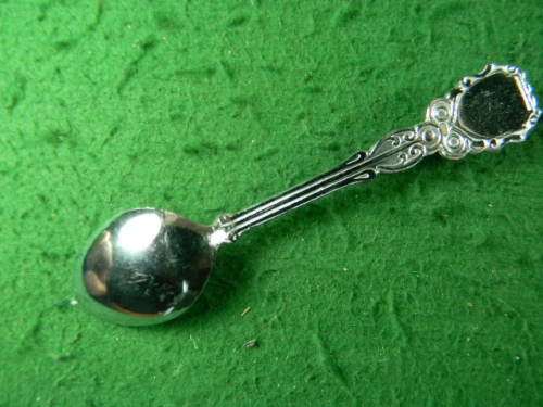 Crome plated spoon with gem stone in good condition
