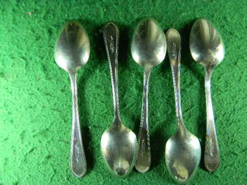 set of 5 sipelia rustles nickel silver spoons Sheffield show small brown spot in spoon