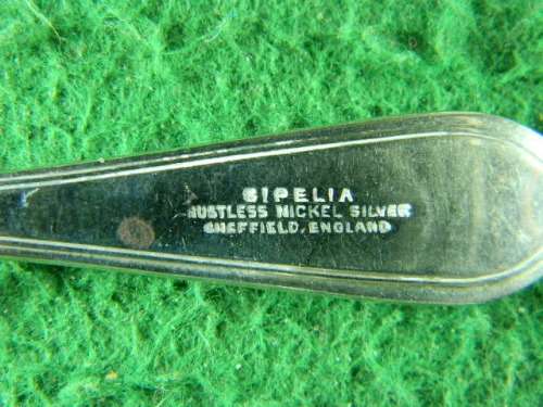 set of 5 sipelia rustles nickel silver spoons Sheffield show small brown spot in spoon