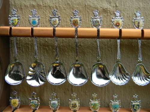 36 Souvenir  spoons as per pictures 12 sugar +12 with inlays spoons in good condition with free rack
