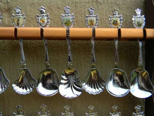 36 Souvenir  spoons as per pictures 12 sugar +12 with inlays spoons in good condition with free rack