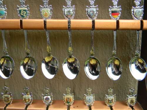 36 Souvenir  spoons as per pictures 12 sugar +12 with inlays spoons in good condition with free rack