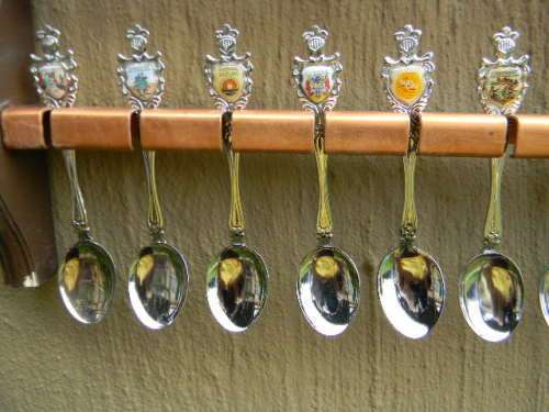 36 Souvenir  spoons as per pictures 12 sugar +12 with inlays spoons in good condition with free rack
