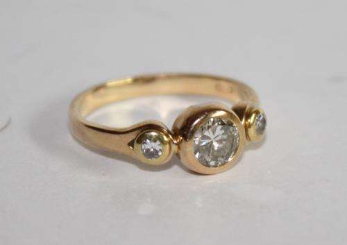 18ct Gold Diamond Ring set with 3 Diamonds-centre stone app .52ct.