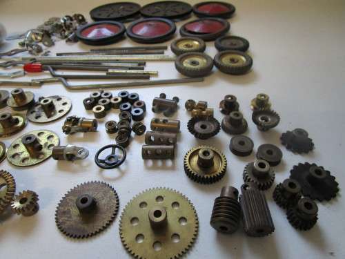 **Meccano Parts**..As per Photos.....Red/Green Parts plus Gears/Pulleys etc..Played Condition.