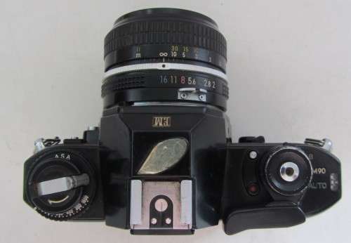Nikon EM SLR-Nikkor 50mm 1:2 Nikon Lens(needs cleaning)Shutter Fires Smoothly