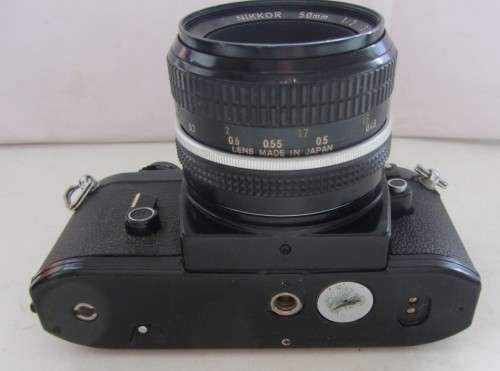 Nikon EM SLR-Nikkor 50mm 1:2 Nikon Lens(needs cleaning)Shutter Fires Smoothly